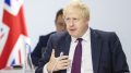 Boris Johnson, nærbilde med flagg. Foto